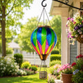 Chroma geometric hot air balloon solar lantern hanging beside a colorful garden porch