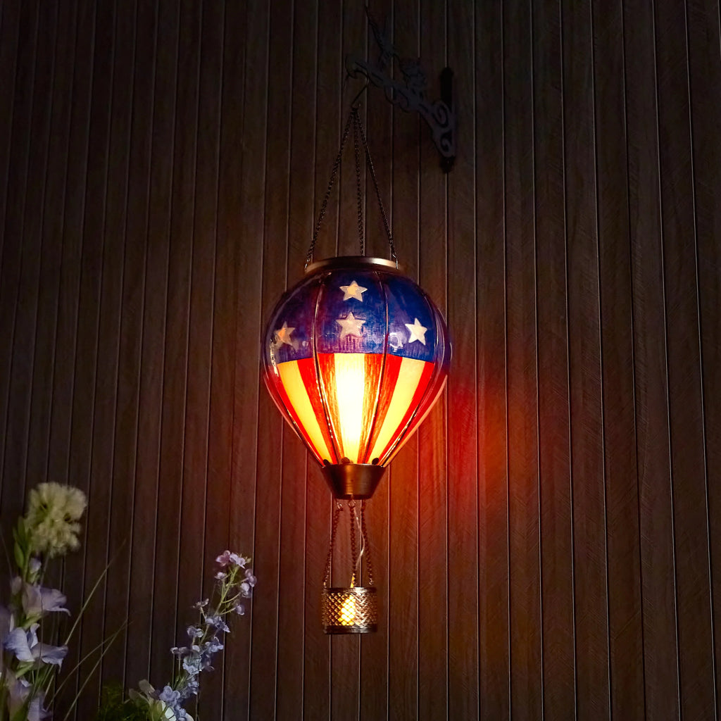 hand-painted solar hot air balloon lantern enhancing front yard decor and garden ambiance