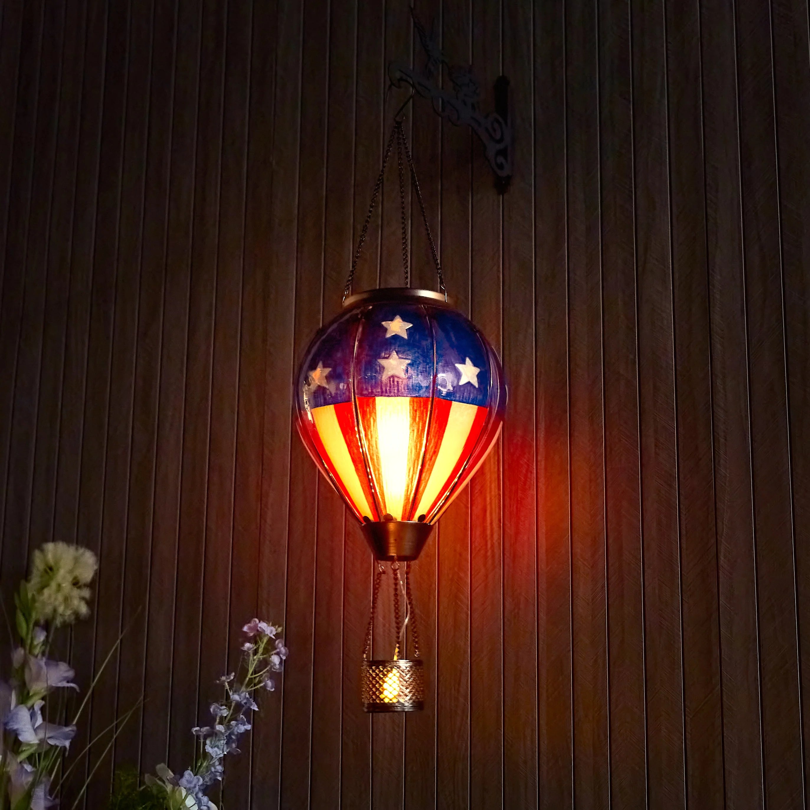hand-painted solar hot air balloon lantern enhancing front yard decor and garden ambiance